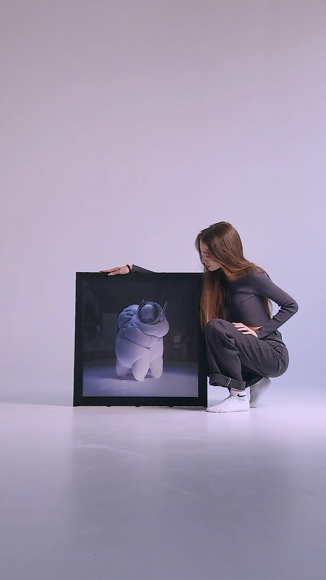 Framed art print of two astronauts embracing, with skulls visible inside their space helmets, set against a cosmic space background